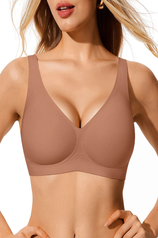 Woman wearing a beige bra against a neutral background